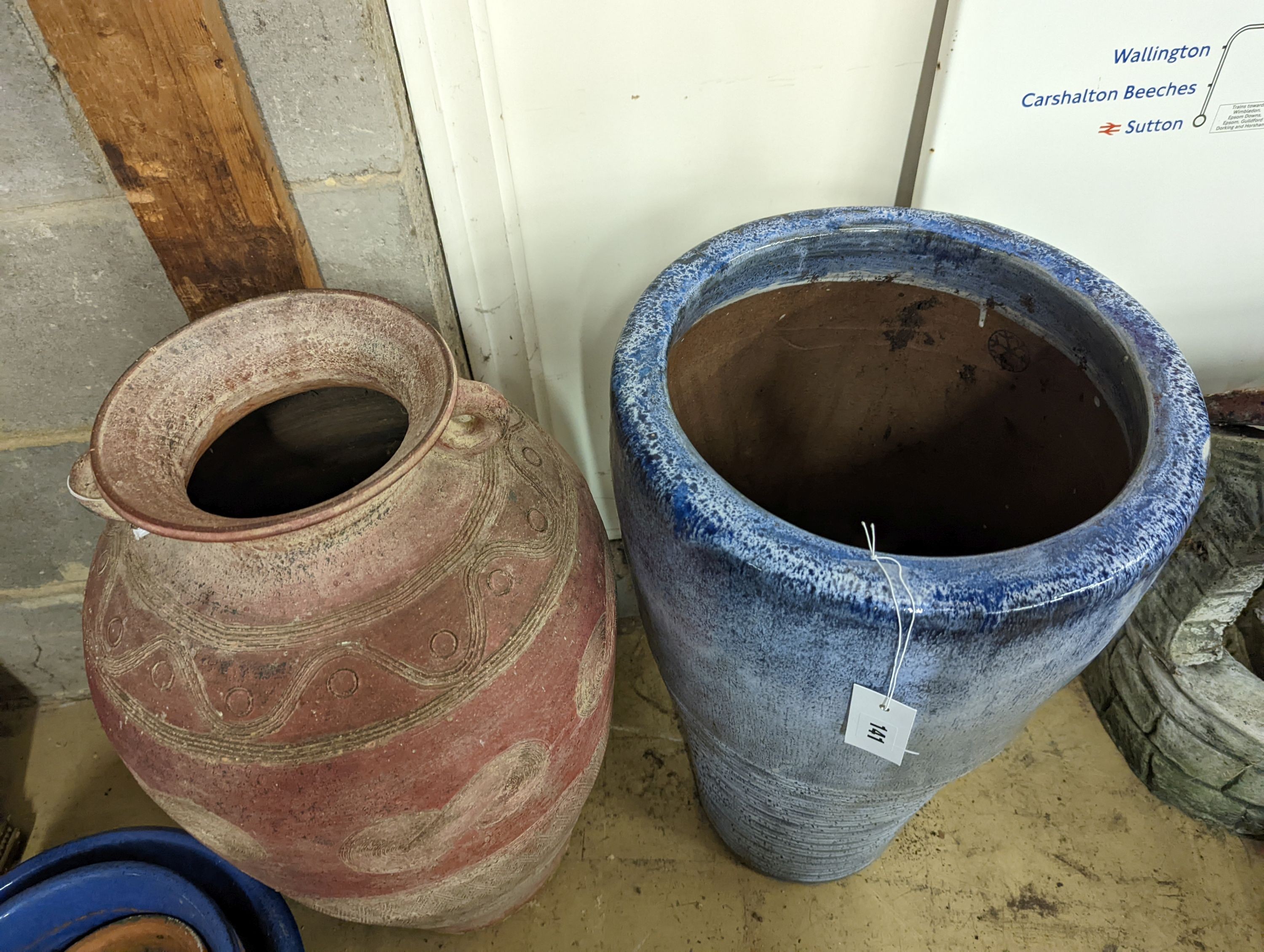 Two glazed earthenware garden planters, largest height 66cm